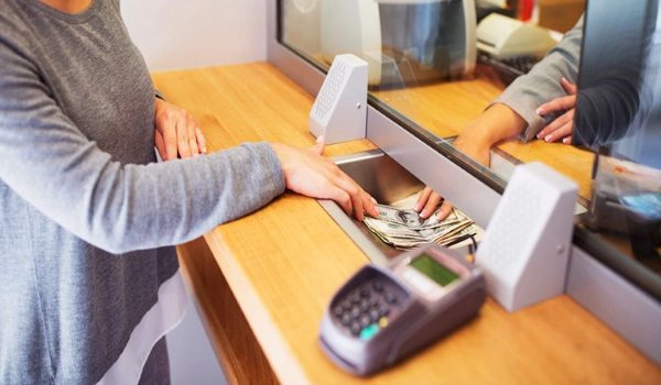 purchase money orders at ACE person purchasing a money order with cash